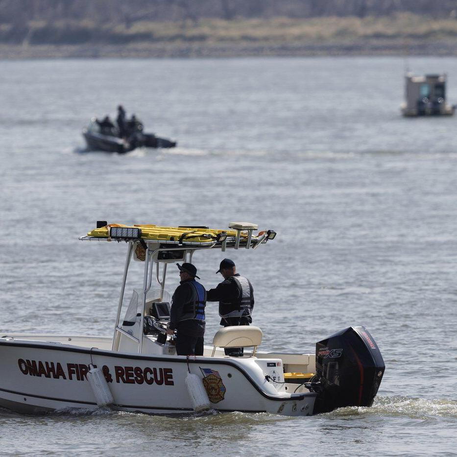 Nebraska officials search the Missouri River near Omaha for two teens and a child